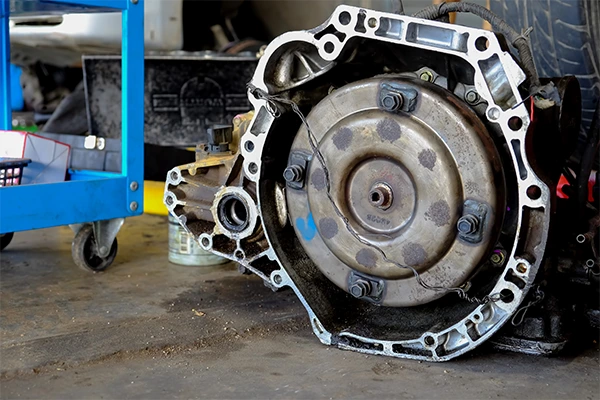 Mounting point of automatic transmission sitting on floor of repair shop