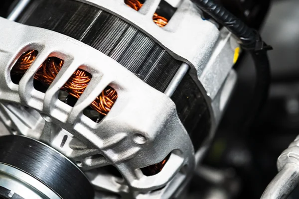 Close-up of alternator in engine bay of vehicle