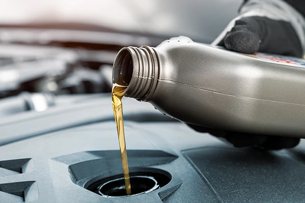 Oil being poured into an engine 
