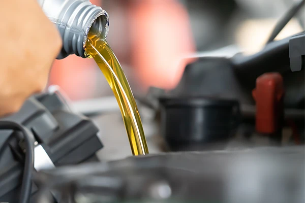Oil being poured into engine 